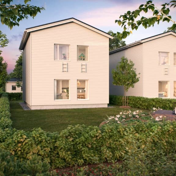 Kastellin Verso 100 on kaksikerroksinen asunto jonka julkisivu on valkoinen, vihreän nurmikon ympäröimänä.
